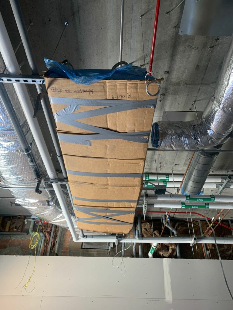 HVAC PROTECTION: Cover chilled beams with cardboard after installation