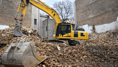 Construction WAste Management - excavator scooping up debris